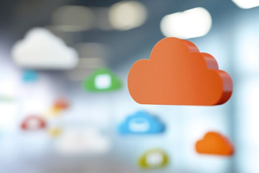 Orange cloud icon floats, office background data storage photo