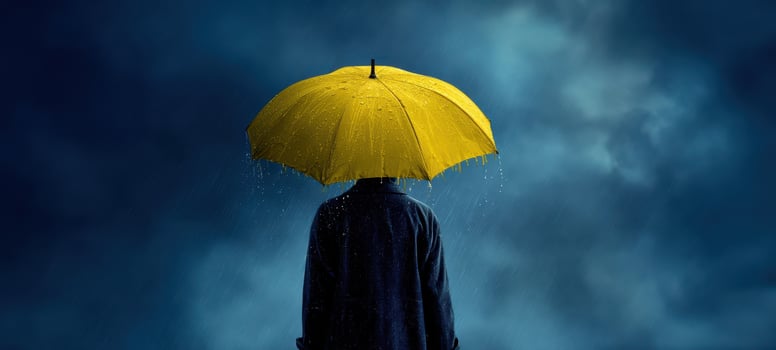 The Yellow Umbrella Shielding a Lone Figure Beneath Moody Storm Clouds at Night photo