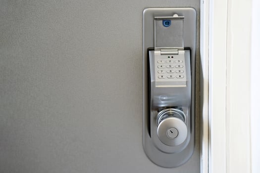 Close-up push-button lock of entrance doors at office photo