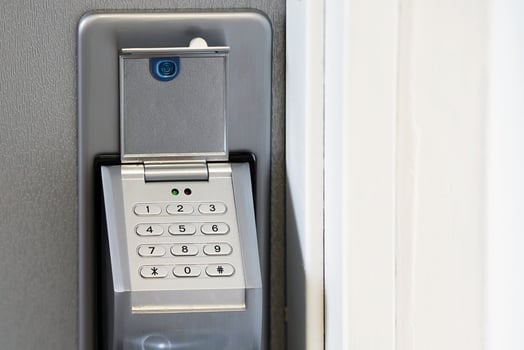 Close-up push-button lock entrance doors in office photo