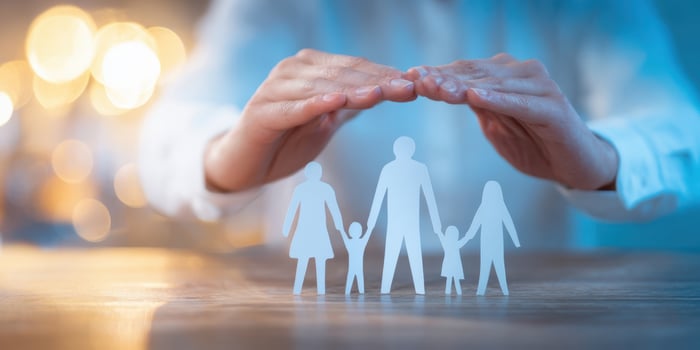 The hands protecting a family symbol in a serene environment. photo