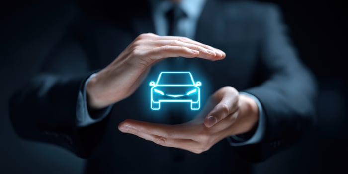 The Hands Protecting a Holographic Car in a Modern Business Environment photo