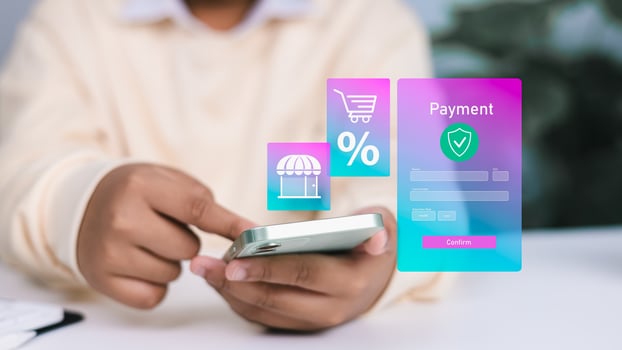 Person using smartphone with holographic online payment form, shopping cart, and discount icons, representing e-commerce, mobile shopping, and secure digital transactions. photo