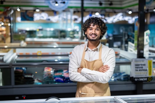 Store employee in grocery aisle photo