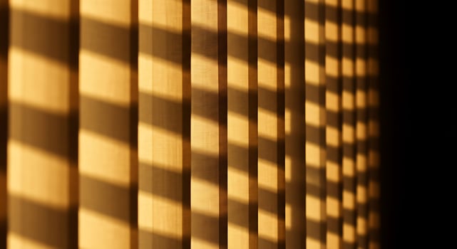A close up of a wall with wooden blinds photo