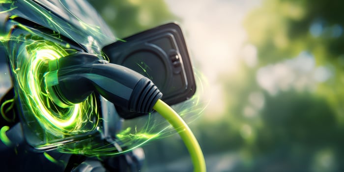 The electric vehicle charging with a vibrant green energy connection. photo