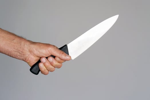 Kitchen knife in a hand photo