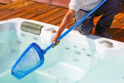 Hotel staff worker cleaning the jacuzzi photo