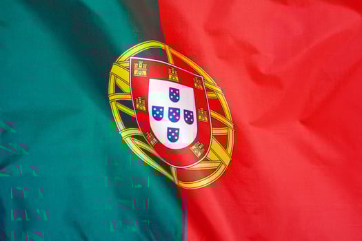 Flag of Portugal. Flag of Portugal waving in the wind. photo