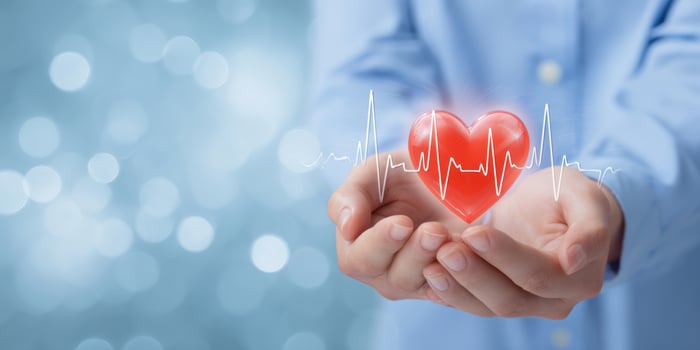 The Heart Represents Pulse and Health in Caring Hands photo
