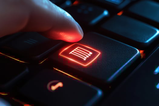 A person is pressing a red button on a computer keyboard photo