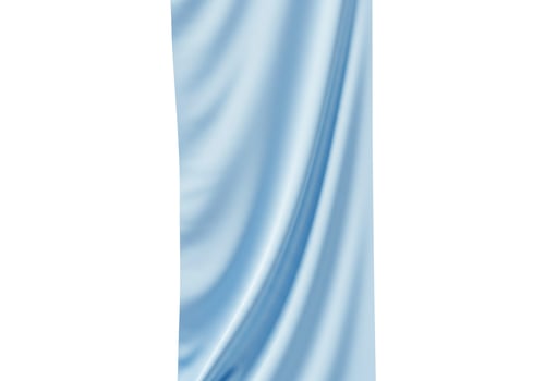 Soft blue fabric with elegant folds isolated on white background photo