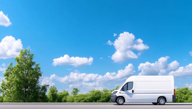 White van drives on sunny road, trees background delivery photo