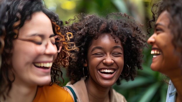 Diverse women laughing friends sharing joyous moment togetherness photo