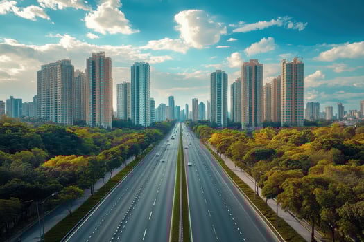 An empty highway with tall buildings in the background photo