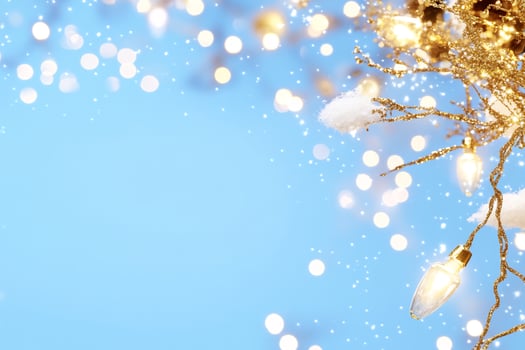 Festive winter lights, snow, bokeh background. Holiday greeting card photo