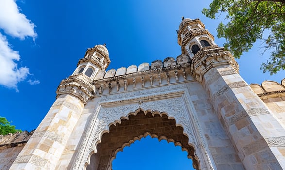 Majestic Indian archway, sunny day, trees, travel photo