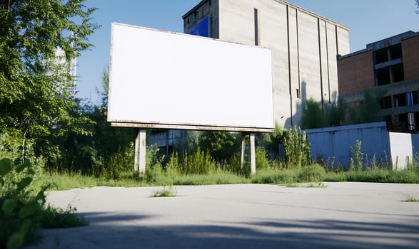 Blank billboard, overgrown lot, urban decay, sunny day, advertising mockup photo
