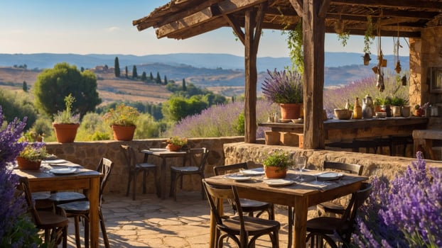 Serene outdoor dining area with rustic tables, lavender fields in the background, and mountains photo