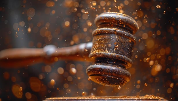 Wooden gavel with floating particles symbolizing law and justice photo
