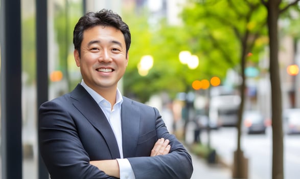 Professional man smiling confidently in urban setting with greenery photo