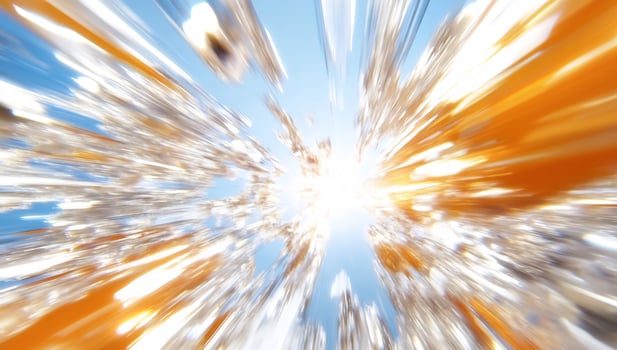 Dynamic explosion of light and color against a bright blue sky backdrop photo