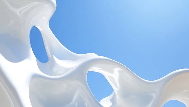 Abstract white sculpture against a clear blue sky with sunlight photo