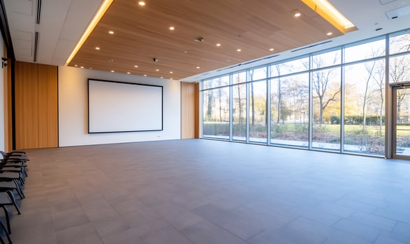 Modern empty conference room, large windows, park view, event space photo