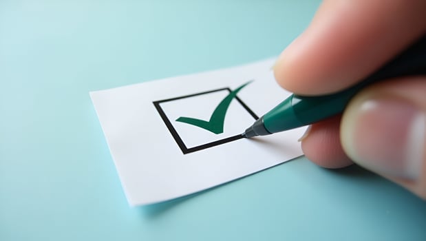 Hand places checkmark on ISO 14001 label representing quality control and certification for environmental management systems EMS concept as Hand places checkmark on ISO 140 Act 4 photo