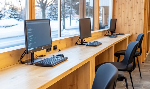 Modern computer lab, winter view, wood desk, coding photo