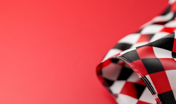 Red background, checkered flag, racing, victory, celebration photo