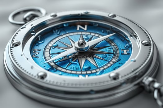 Detailed blue and silver compass for direction and navigation photo