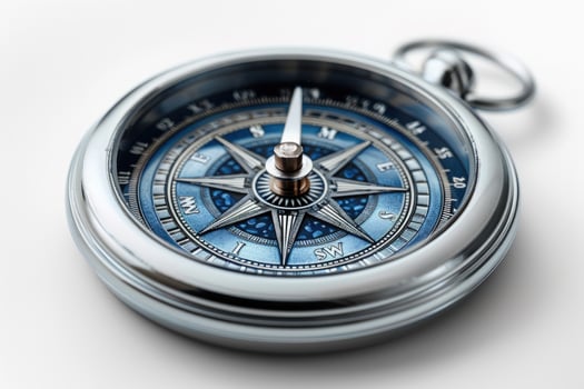 Silver compass on white background for travel and navigation concepts photo