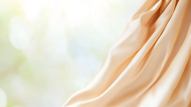 Elegant flowing silk fabric draped softly with a blurred background photo