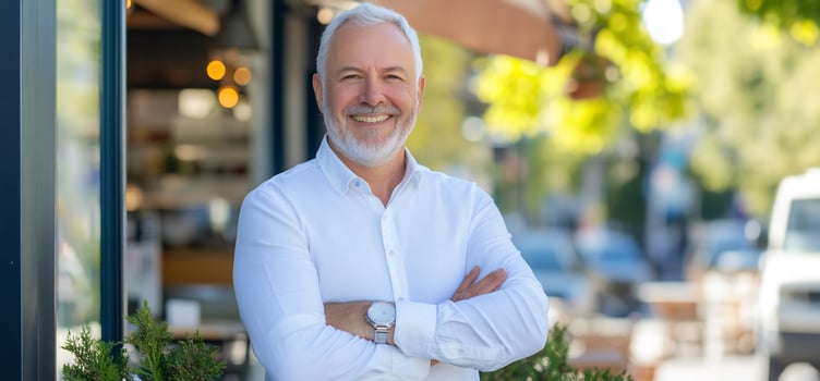 Confident senior businessman outside cafe photo