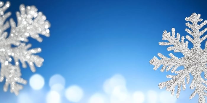 Silver snowflakes, winter bokeh, blue sky, festive background photo