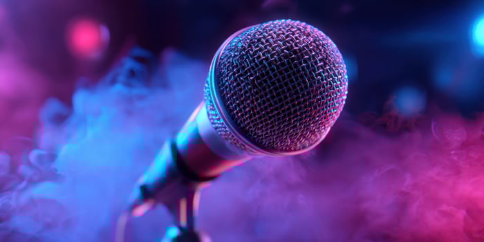 The glamorous microphone surrounded by colorful smoke and vibrant lighting. photo