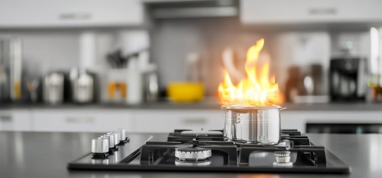 Kitchen scene with a pot on fire, showcasing a modern cooking environment photo
