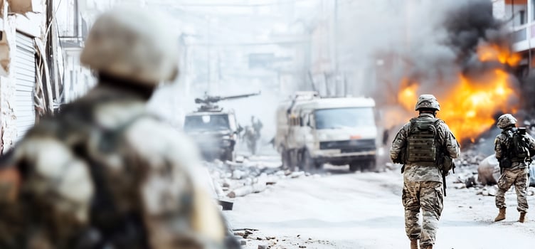 Soldiers in warzone, city street fire, military action photo