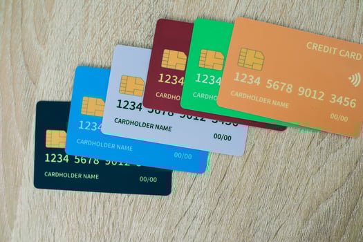 Colorful Array of Credit Cards on Wood Grain Surface for Financial Concepts photo
