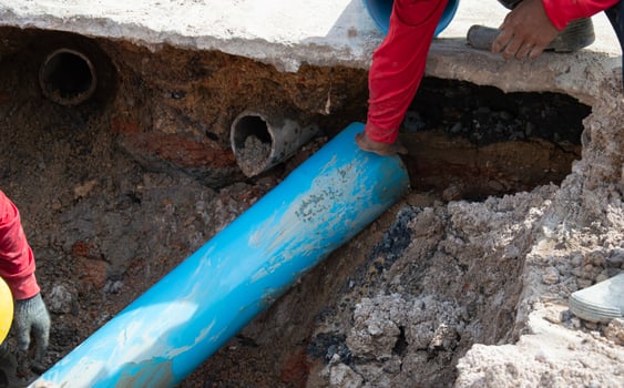 Workers are installing PVC pipes. photo