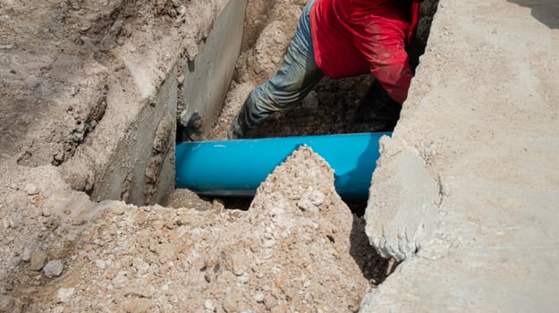 Worker are installing PVC pipes. photo