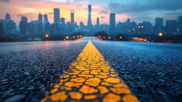 Road to cityscape at twilight with yellow line photo