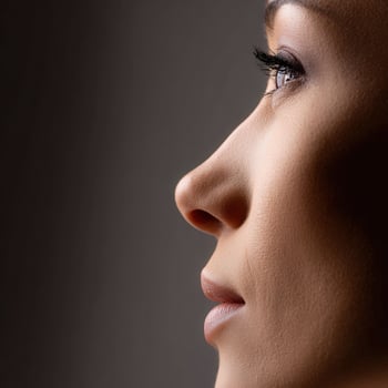 A woman with long eyelashes and a long nose photo