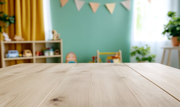 Empty wooden table in playroom photo