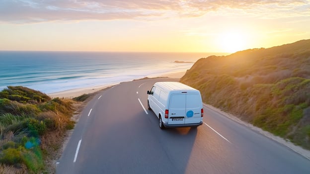 Coastal road trip van drives sunset ocean view photo