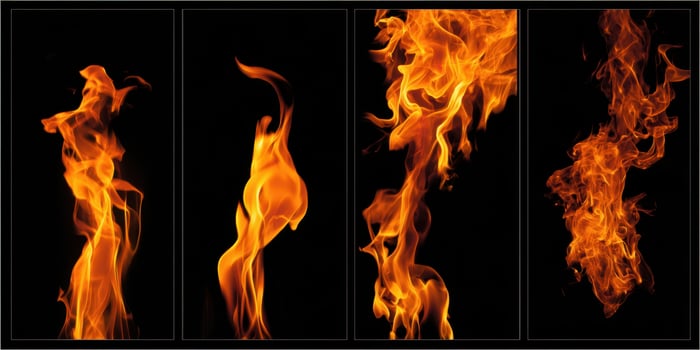 The Flames Dancing in Vivid Angles Against a Dark Background photo