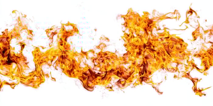 The Dynamic Dance of Flames on a Bright White Background photo