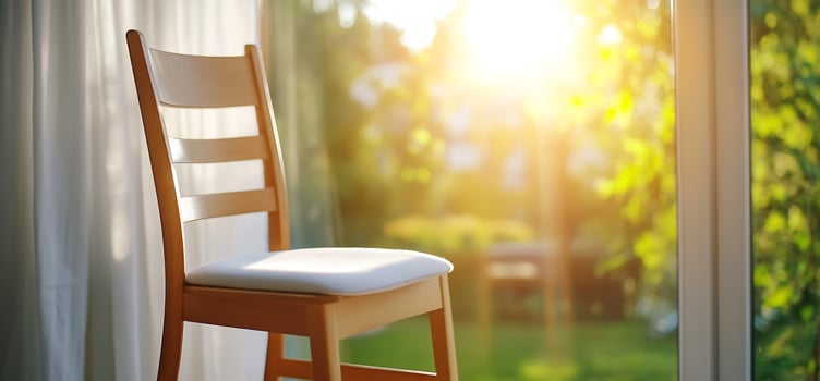 Sunny chair by window, garden view. Home calm photo