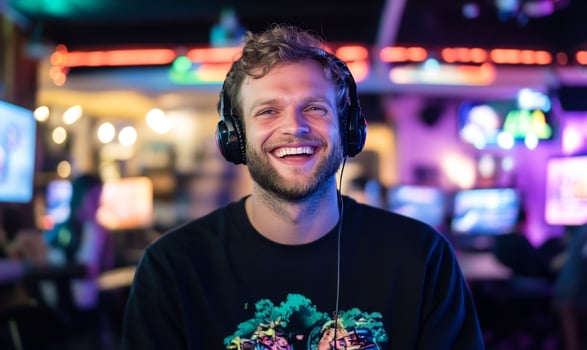 Happy gamer in arcade, neon lights photo